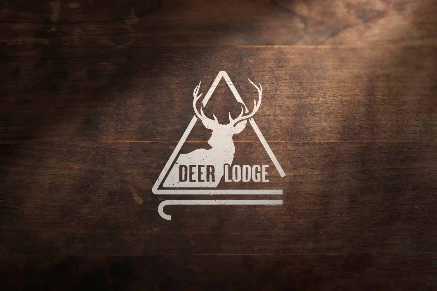 A logo featuring the silhouette of a deer inside a triangle.