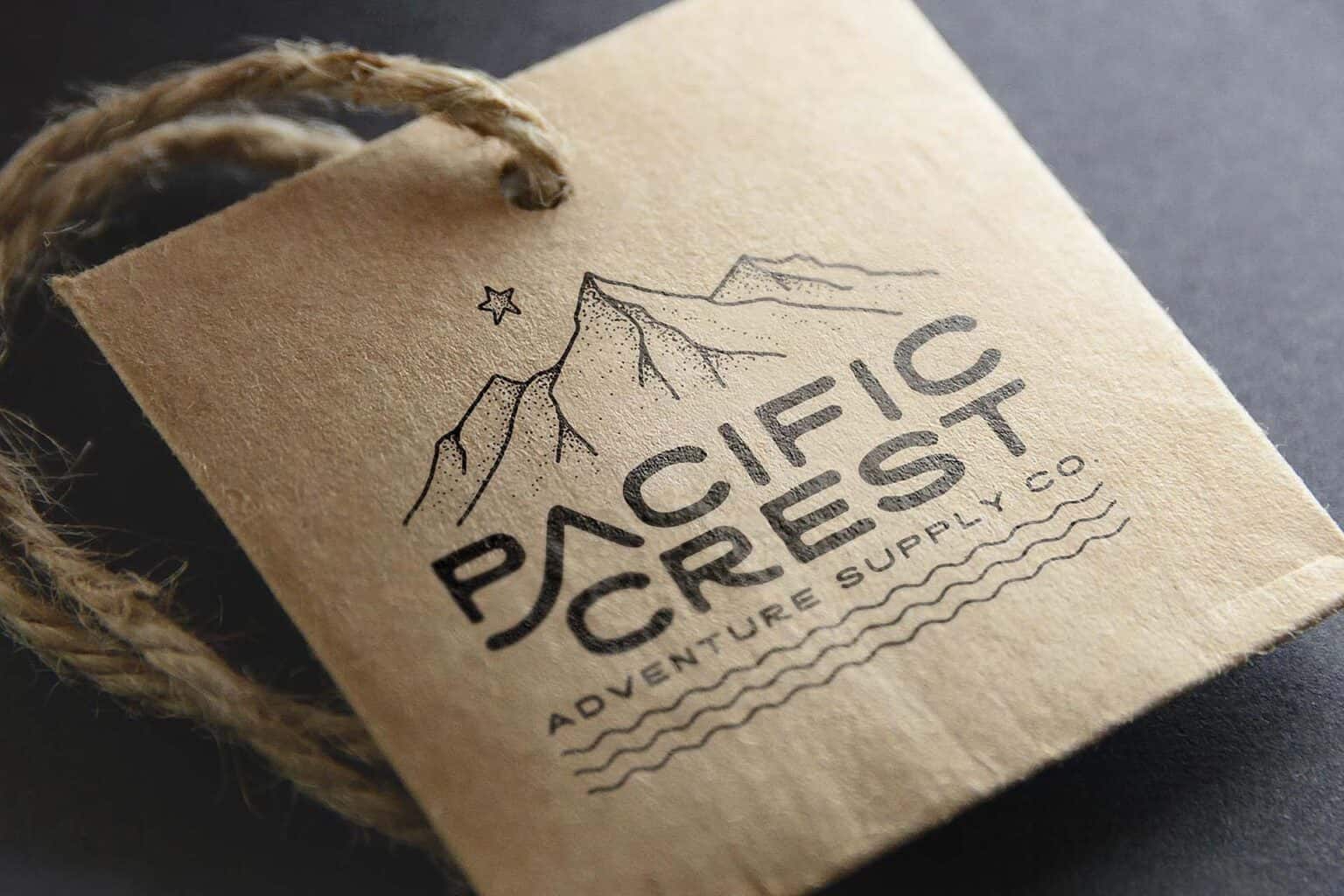 Pacific Crest logo typeface with illustration of mountains and waves