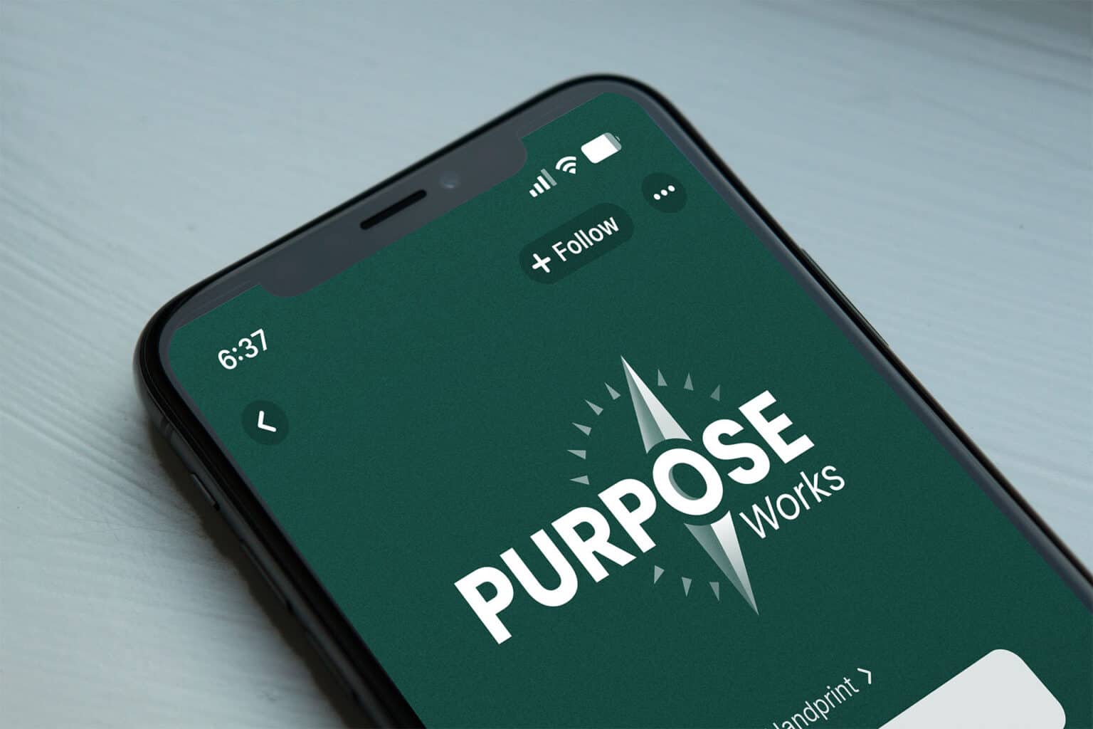 iPhone mockup with Purpose Works podcast logo